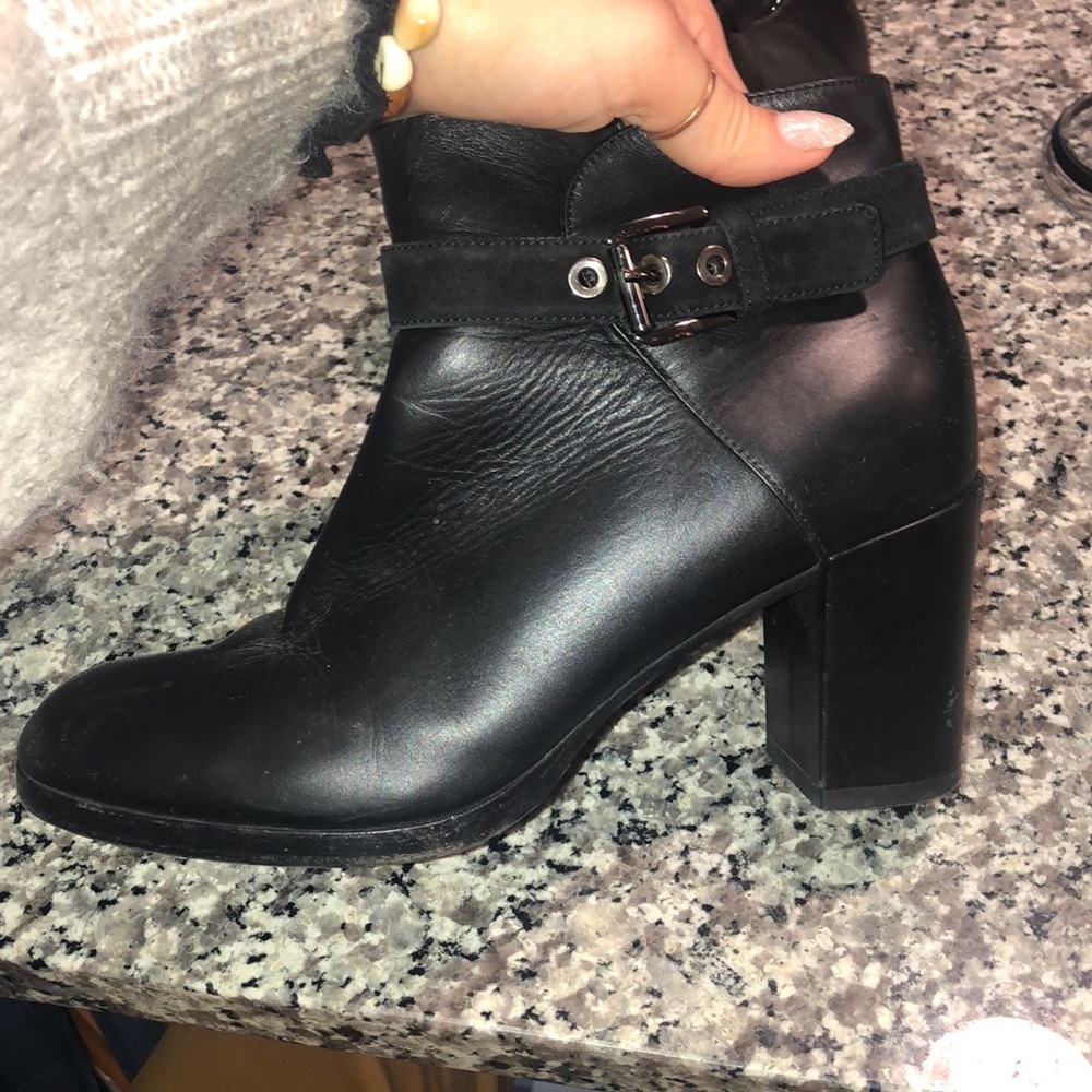 Black leather ankle boots with buckle